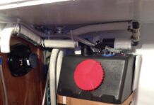 Misirlou’s gravity drain holding tank mid-installation showing tank valve, Tee to deck pump-out fitting and home-made activated charcoal vent filter. (Photo/ Tom Egan)